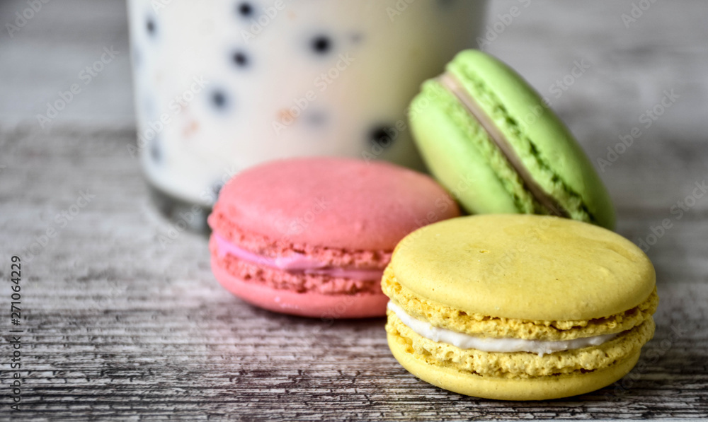 colorful macaroons on wooden table colorful macaroons on wooden table