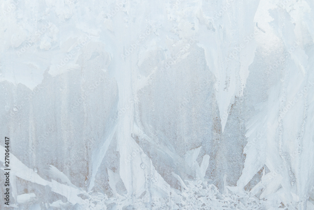 Fototapeta premium Frosty patterns on a frozen ice box in the early morning