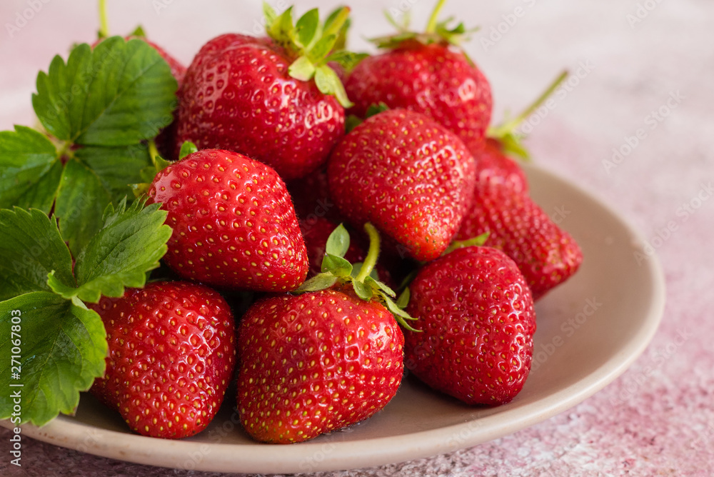 Fresh juicy strawberry on a concrete background. It can be used as a background Fresh juicy strawberry on a concrete background. It can be used as a background
