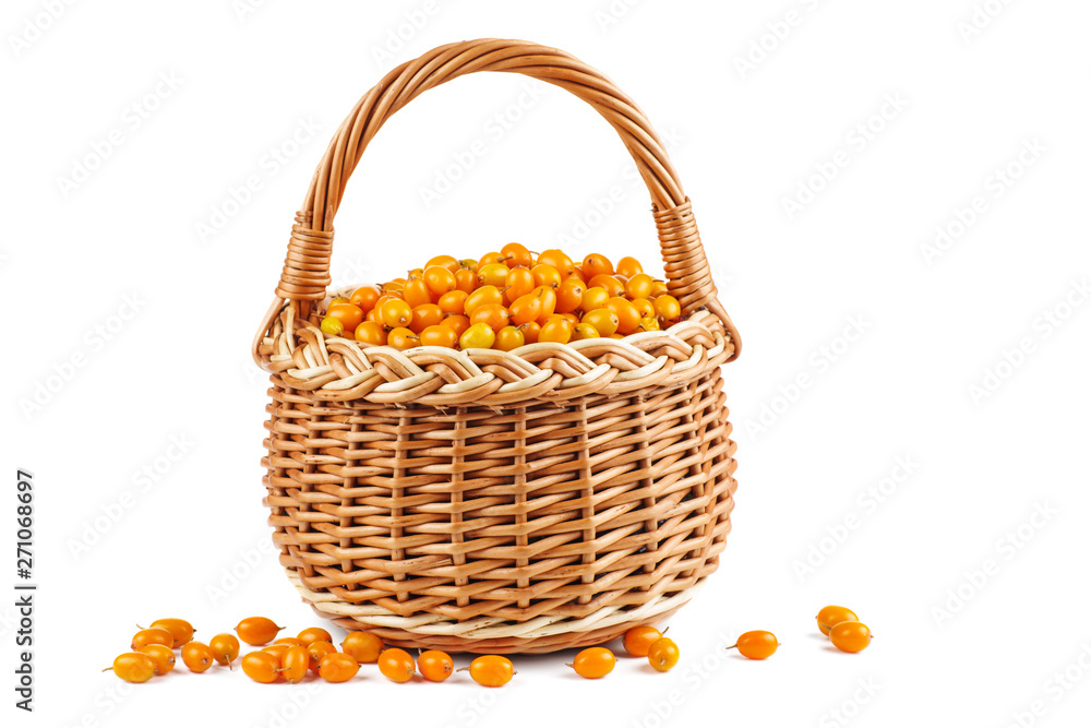 Wicker basket with sea buckthorn berries isolated on white background Wicker basket with sea buckthorn berries isolated on white background