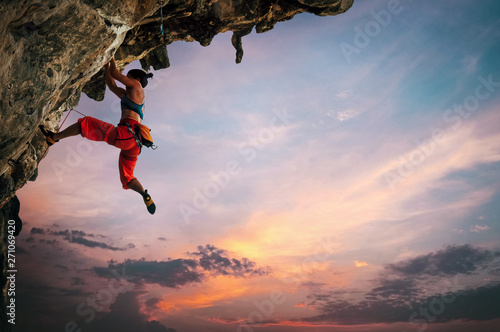 Woman climbing on rock