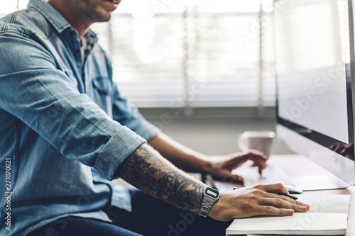 Businessman working with laptop computer.creative business people planning and using pen in modern work loft