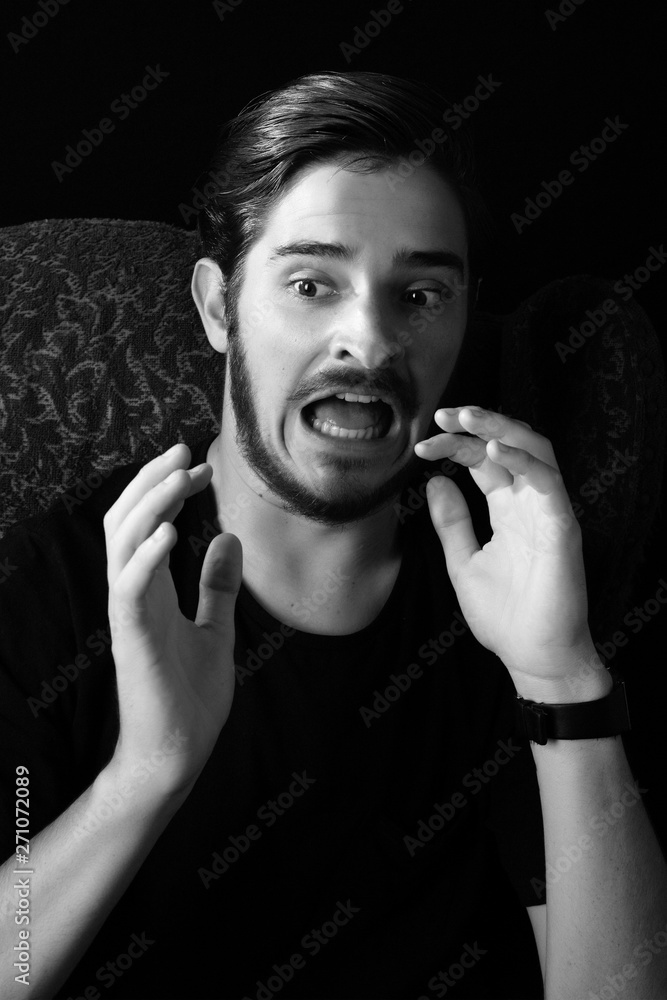 Horror Scene With Screaming Scary Human Face With A Harsh Light On A Black  - Halloween Concept With Young Man With Open Mouth And Teeth Stock Photo,  Picture and Royalty Free Image.