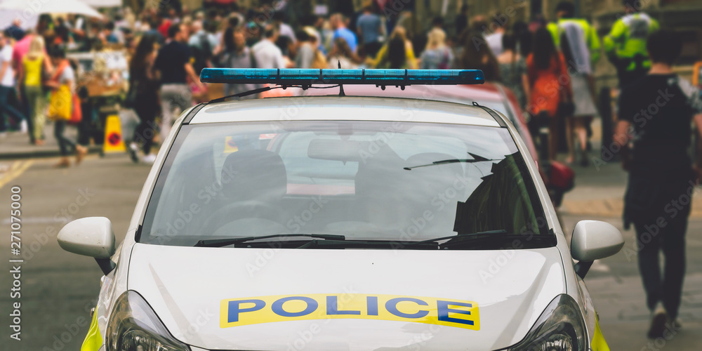 Front of parked Police Car, Walking People in Blurred Background, Shallow Depth of Field, Bristol England 2019 Front of parked Police Car, Walking People in Blurred Background, Shallow Depth of Field, Bristol England 2019