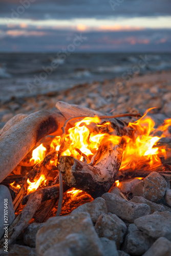 fire burns near the sea