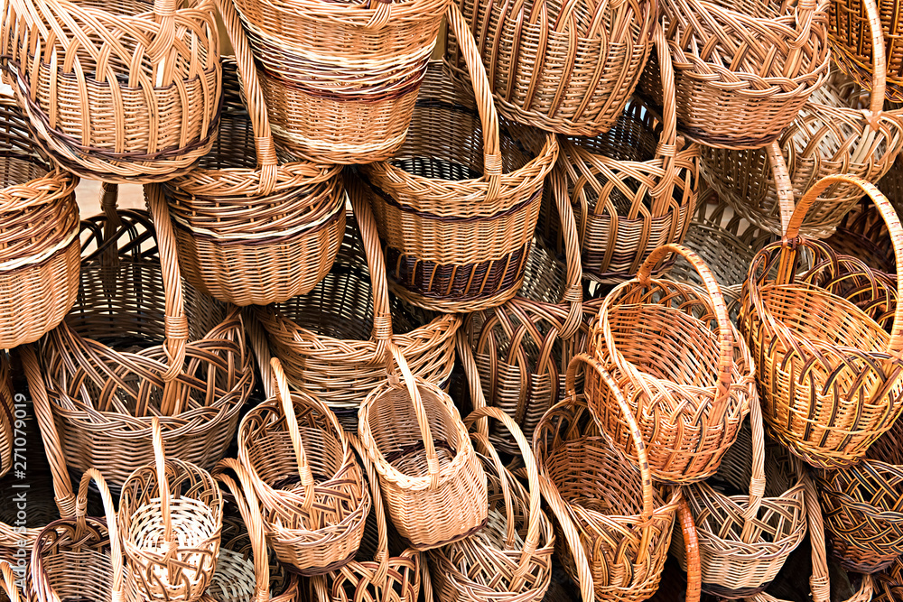 many different wicker baskets as a background many different wicker baskets as a background