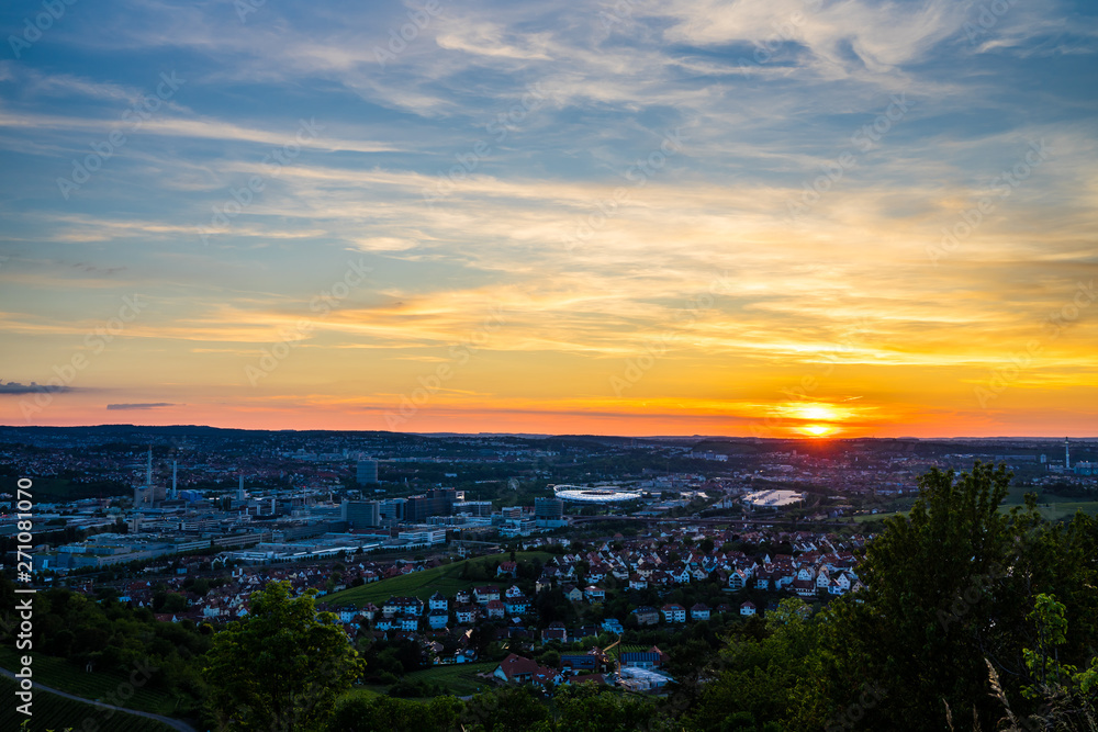 Germany, Stuttgart downtown city district bad canstatt with stadium and industry from above in pretty orange sunset light