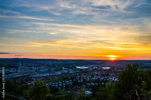 Germany  Stuttgart downtown city district bad canstatt with stadium and industry from above in pretty orange sunset light
