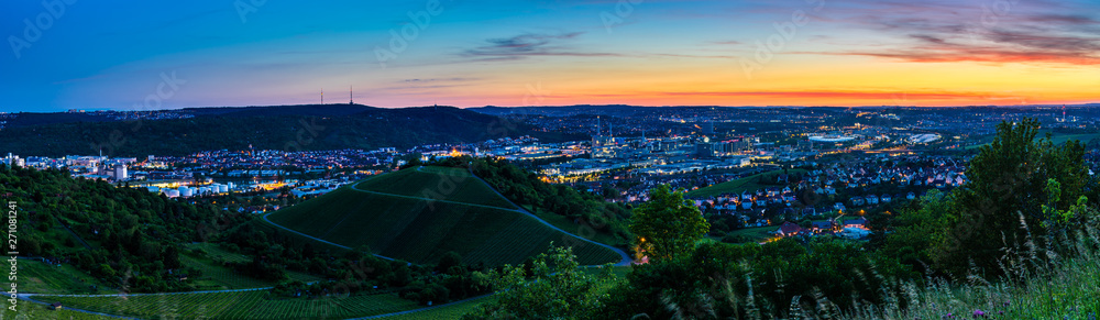 Germany, XXL panorama of downtown stuttgart city, houses and skyline from above in magic dawning atmosphere
