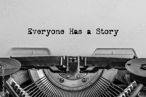 Everyone has a story printed on a vintage typewriter. photo