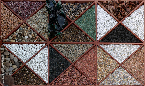 Multi-colored samples of marble, granite, and travertine chips and pebbles for landscape design