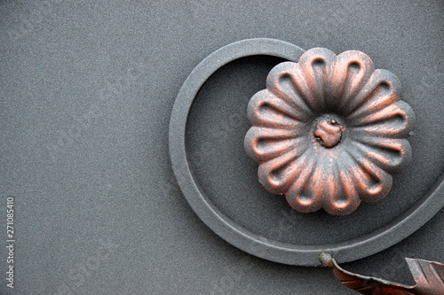  the flower is made of metal on a gray background. blacksmithing