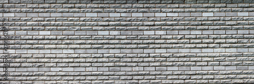 panorama of the gray wall of brick and stone