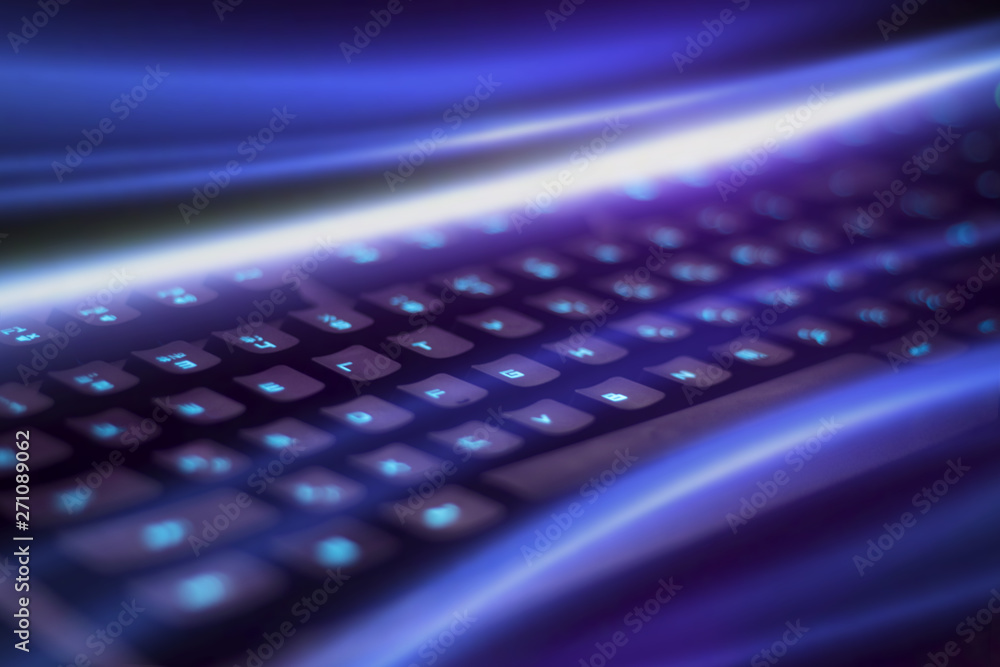 Closeup of keyboard illumination, neon rays backlight Closeup of keyboard illumination, neon rays backlight