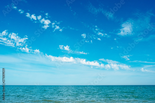 Blue turquoise sea and sky clouds