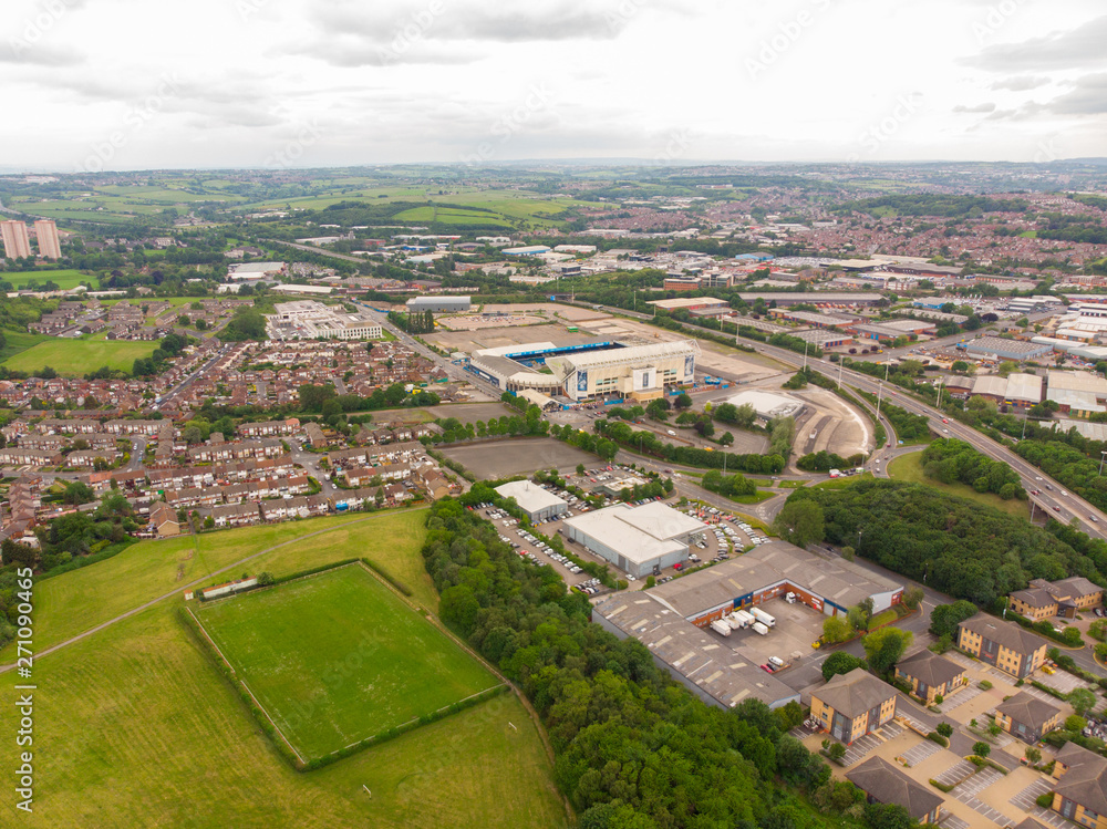 Aerial photo over looking the whole of Leeds from the Beeston area of the City Centre in West Yorkshire, the photo also shows the Elland Road Leeds United football stadium in the background.