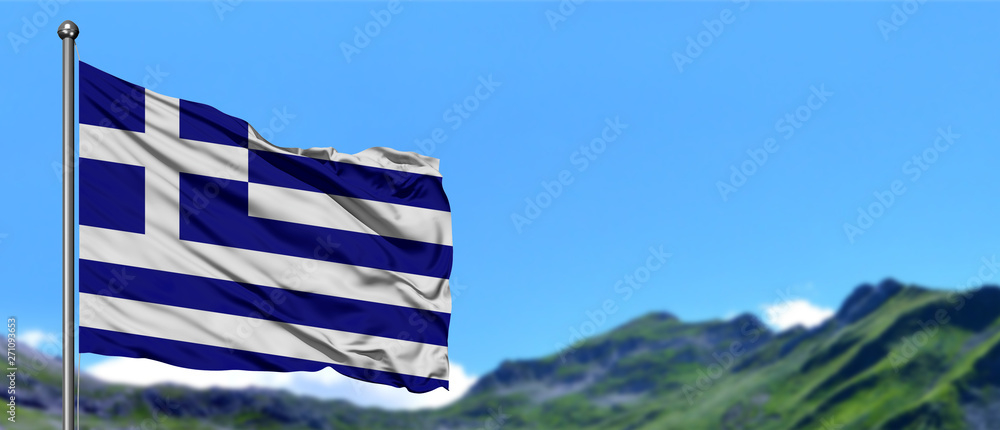 Obraz premium Greece flag waving in the blue sky with green fields at mountain peak background. Nature theme.