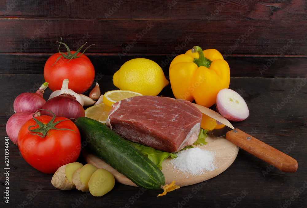 beef with vegetables on wooden background beef with vegetables on wooden background