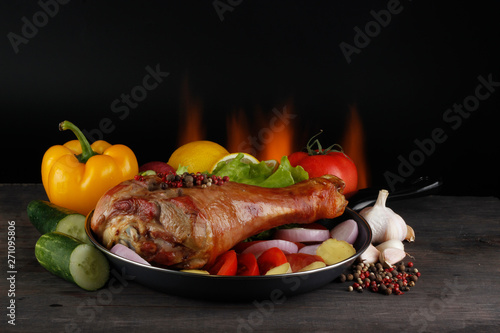 roasted leg of turkey hen on wooden background