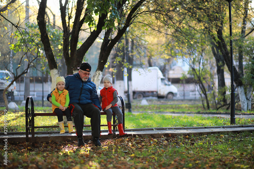 Children walk in the autumn park Children walk in the autumn park
