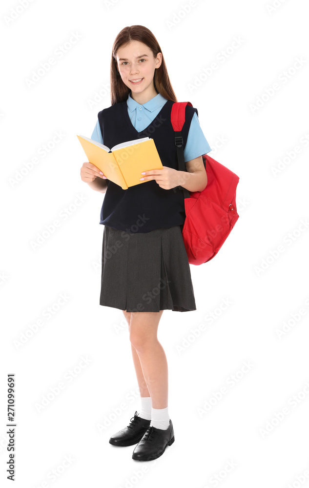 Full length portrait of teenage girl in school uniform with backpack and book on white background Full length portrait of teenage girl in school uniform with backpack and book on white background