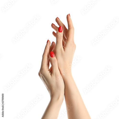 Obraz na plátně Woman showing manicured hands with red nail polish on white background
