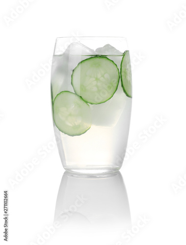 Glass of tasty martini with cucumber on white background