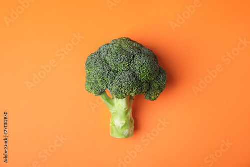 Fresh green broccoli on color background, top view. Organic food