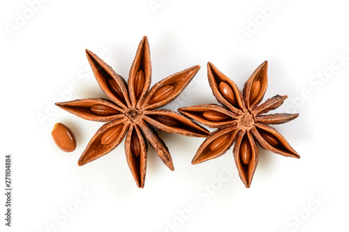 Star anise. Two star anise fruits with seed. Macro close up Isolated on white background with shadow, top view of chinese badiane spice or Illicium verum.
