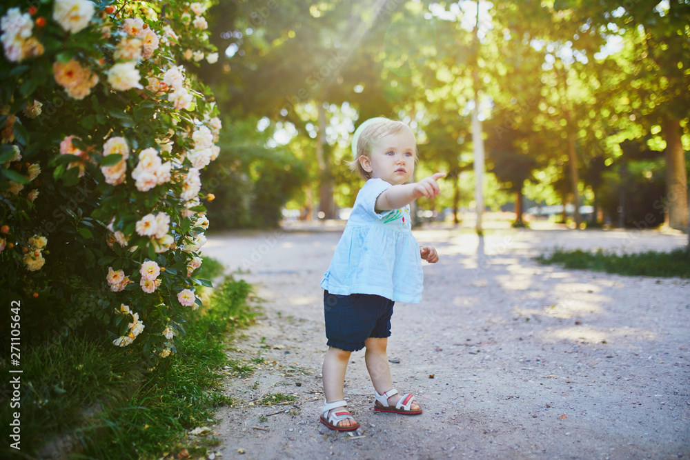 Adorable little girl outdoors in park on a sunny day Adorable little girl outdoors in park on a sunny day