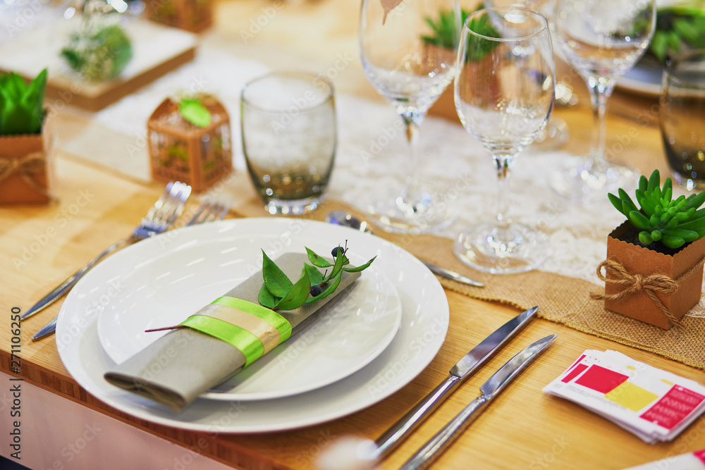 Beautiful table set with candles and flowers Beautiful table set with candles and flowers