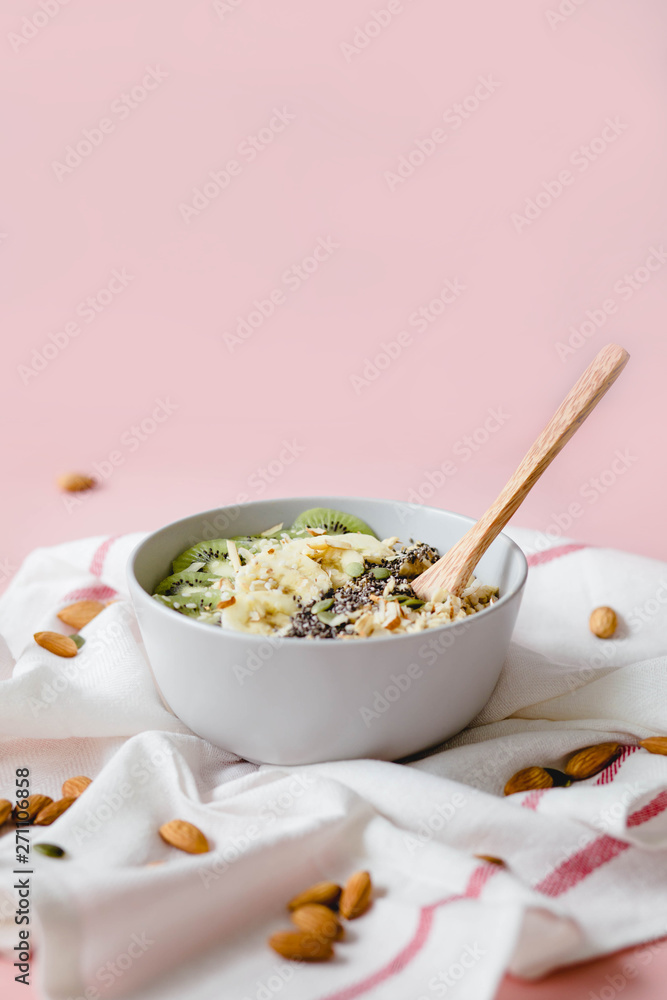 healthy Breakfast of oatmeal with fruit on a white napkin and almond healthy Breakfast of oatmeal with fruit on a white napkin and almond
