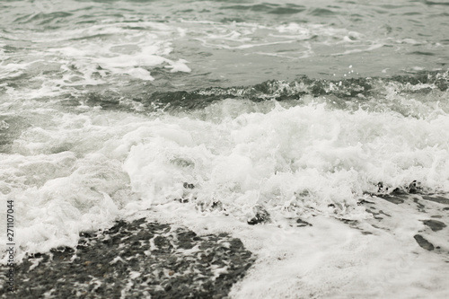 dark sea water background, waves and splash in black sea