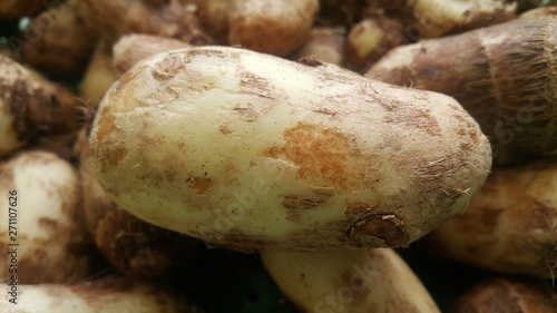Closeup view of taro vegetable pile for sale in market