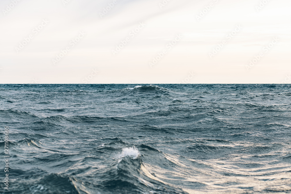 dark blue sea water background, waves of blue in black sea