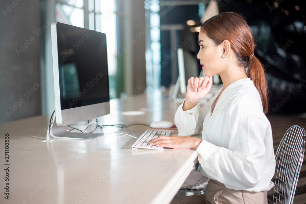 Beautiful business woman is working with her computer Beautiful business woman is working with her computer