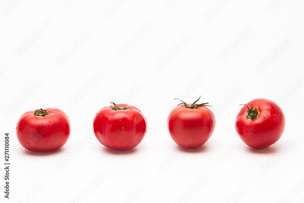 Fresh tasty tomatoes on a white background Fresh tasty tomatoes on a white background