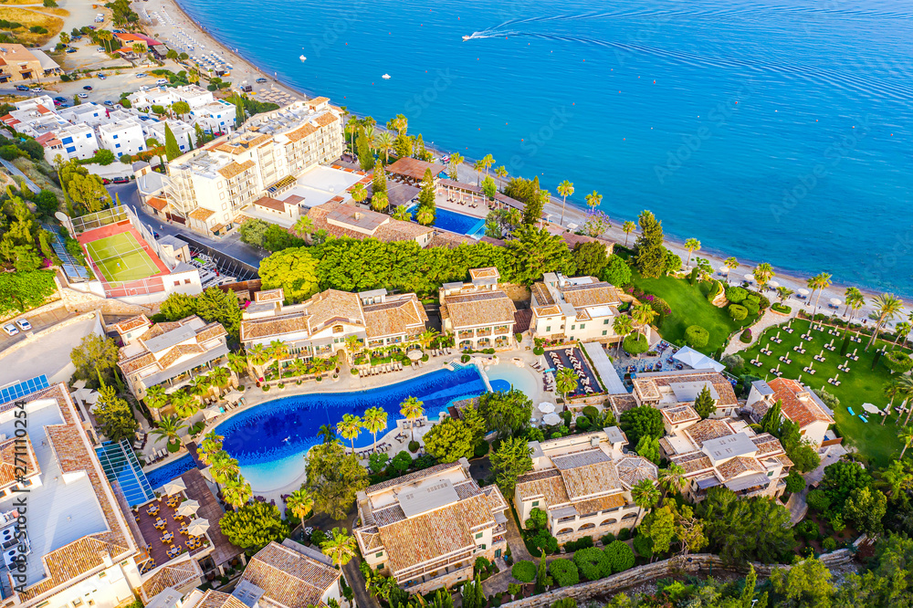 Pissouri. Cyprus Republic. Pissouri village, sunny day top panorama from a drone.  Some resort hotels with pools on the Mediterranean sea coast. The Pissouri spa resorts. Hotel rest in Cyprus.
