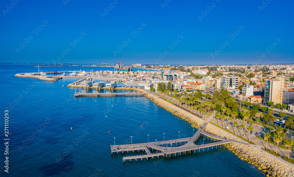 Limassol. Republic of Cyprus sea bay top view. Molos Limassol embankment. Quay piers lead to the sea. Berths for yachting. Mediterranean. The beaches in Cyprus. Travelling to Cyprus. Drone panorama.