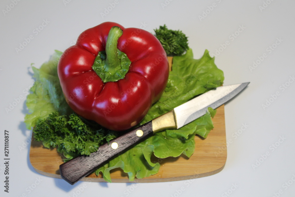 fresh pepper vegetables on cutting board isolated on white fresh pepper vegetables on cutting board isolated on white