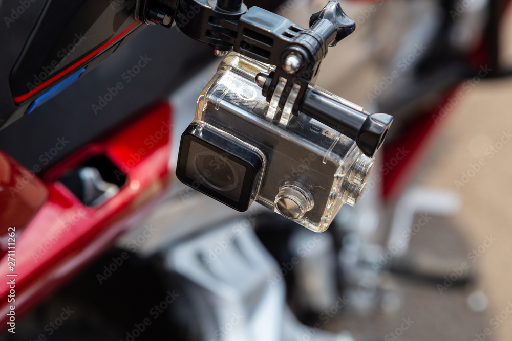 Action camera on a motorcycle rider's helmet Action camera on a motorcycle rider's helmet