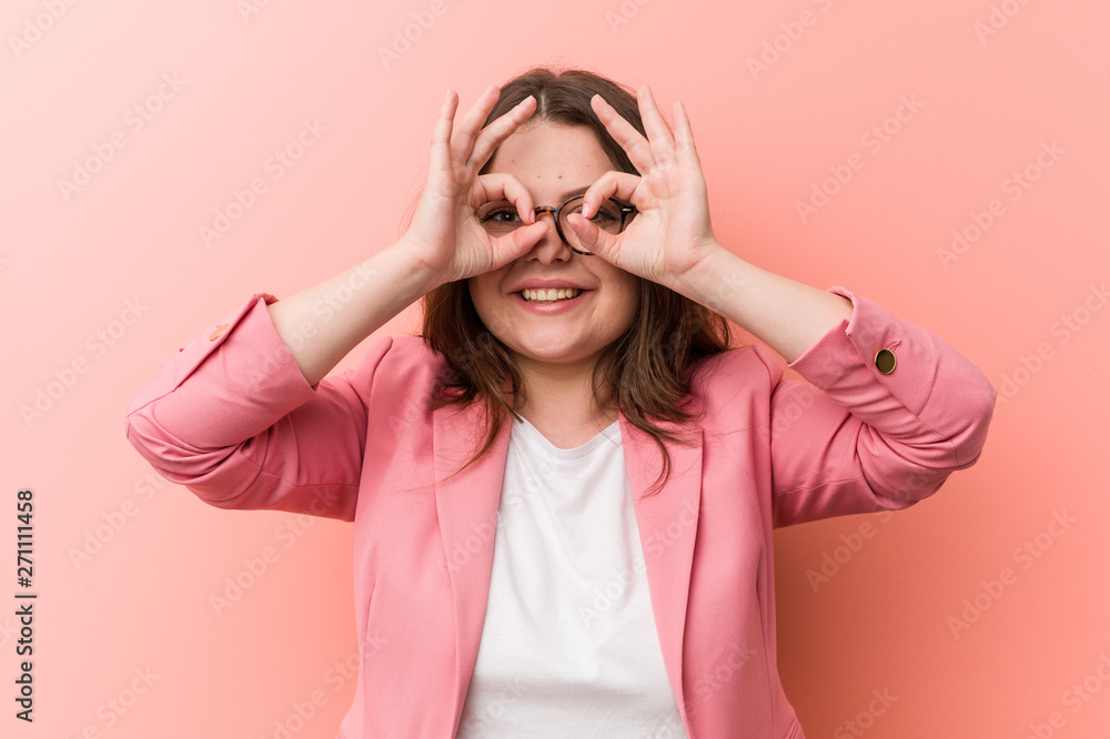 Young plus size business caucasian woman showing okay sign over eyes Young plus size business caucasian woman showing okay sign over eyes