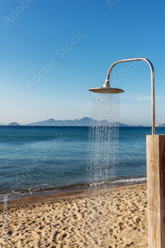 Fototapeta Naklejka Na Ścianę i Meble -  Shoewer on the beach in Greece.