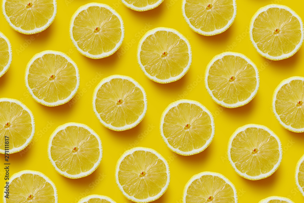 Fresh sliced lemon on yellow background. Fresh sliced lemon on yellow background.