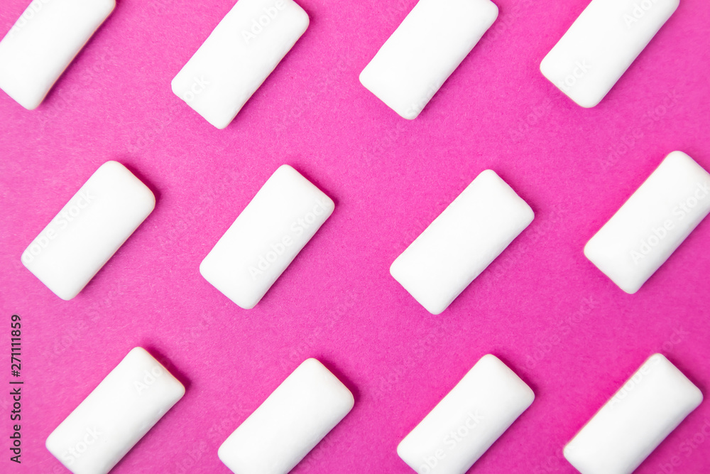 Bubble gum, white dragee on a bright pink background. Stylish photo, minimalism, design, flat lay, top view. Bubble gum, white dragee on a bright pink background. Stylish photo, minimalism, design, flat lay, top view.