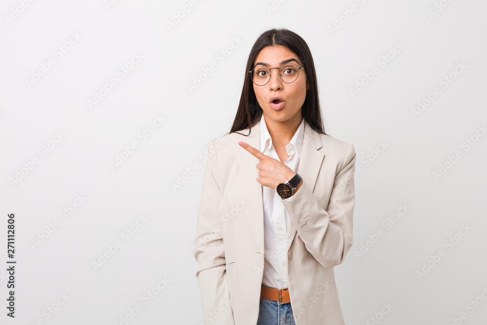 Young business arab woman isolated against a white background pointing to the side Young business arab woman isolated against a white background pointing to the side