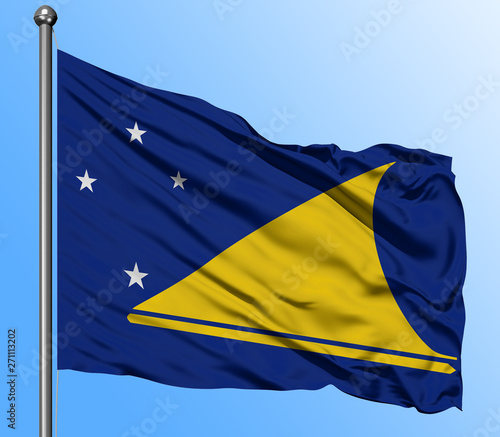 Tokelau flag waving in the deep blue sky background. Isolated national flag. Macro view shot.