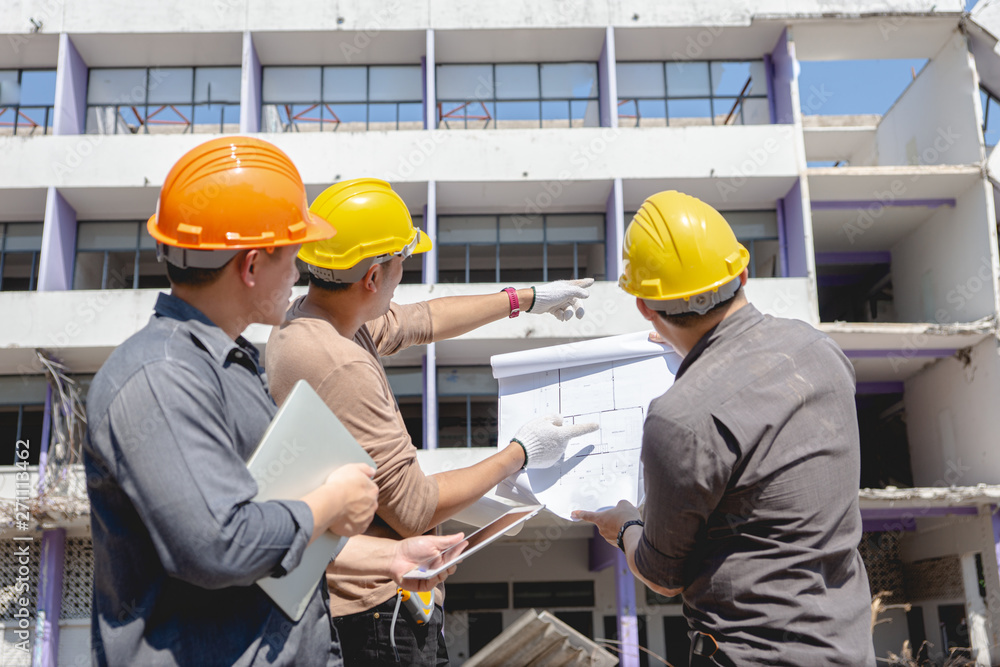 Engineer team and worker checking blueprint for emolition construction plan and inspect at the site. Engineer team and worker checking blueprint for emolition construction plan and inspect at the site.