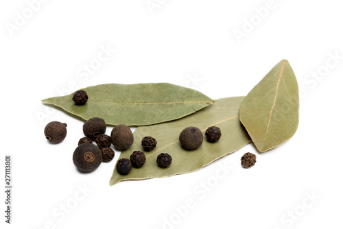 Bay leaf, allspice and pepper isolated on white background