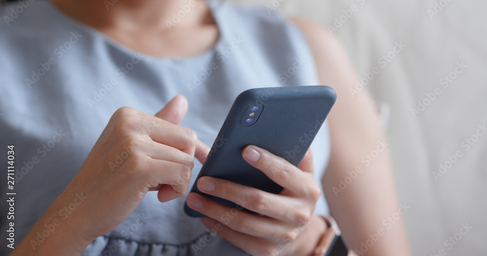 Close up woman use of smart phone at home Close up woman use of smart phone at home